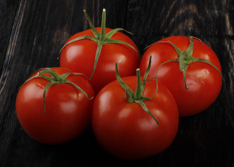 tomatos on wooden background