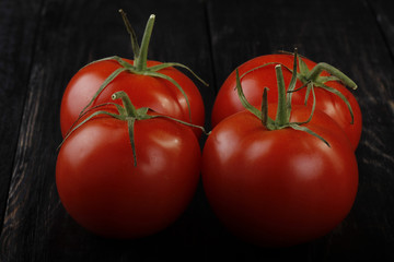 tomatos on wooden background
