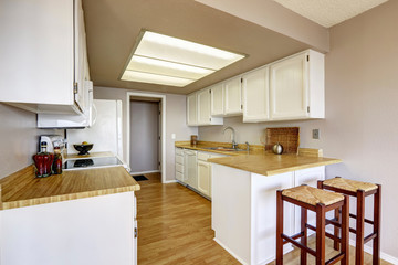 Small kitchen with white cabinets
