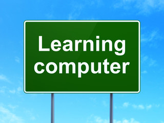Education concept: Learning Computer on road sign background