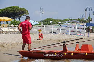 Lifeguard rescue with walkie talkie emergency call