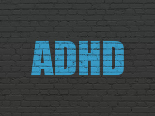 Health concept: ADHD on wall background