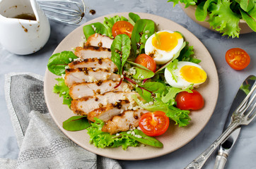 Chicken salad with leaf vegetables and cherry tomatoes