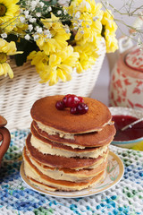 Pancake cake with cream on a plate Still cranberry cowberry