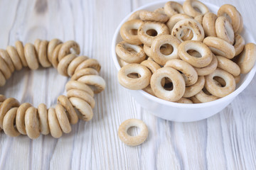A group of bagels on a wooden table