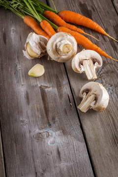 Ingredients for cooking: mushrooms, carrots and garlic