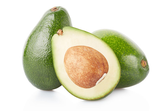 Avocados and half isolated on white, clipping path