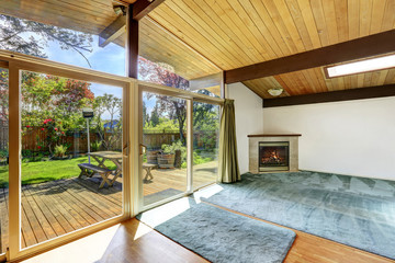 Spacious living room with fireplace and hardwood floor.