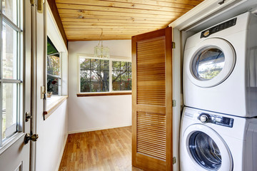 Laundry room with view to fenced back yard