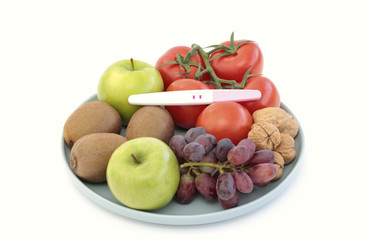 Healthy food with a pregnancy test on top