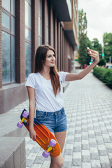 young beautiful long-haired brunette girl in  with colorful long