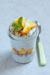 Chia pudding with peach slices in a jar