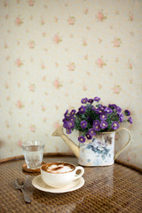 cup of hot coffee on the table.