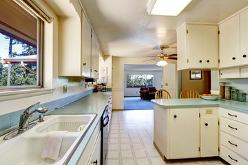 Fototapeta na wymiar White empty simple old kitchen interior