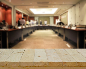 wood table top on blur background of meeting room