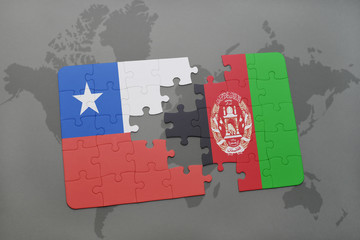 puzzle with the national flag of chile and afghanistan on a world map background.