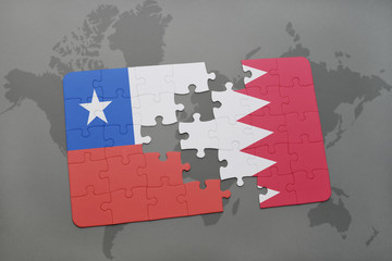 puzzle with the national flag of chile and bahrain on a world map background.
