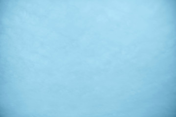 Faded clouds on blue sky