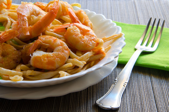 Close up of prawn pasta on grey background