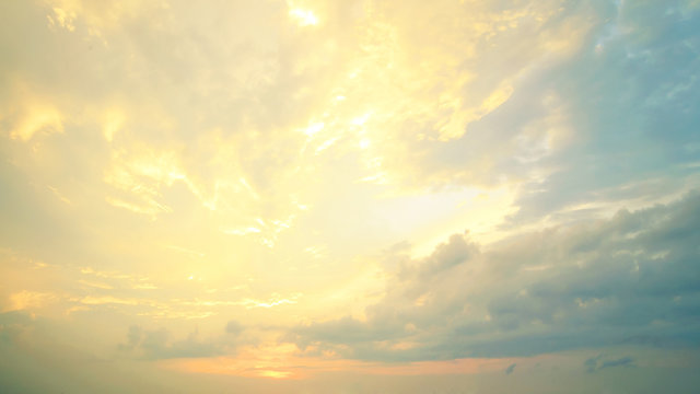 Fototapeta A new heaven and earth concept: Dramatic sun ray with yellow sky and clouds dawn texture background