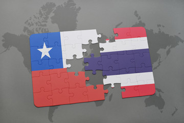 Fototapeta premium puzzle with the national flag of chile and thailand on a world map background.
