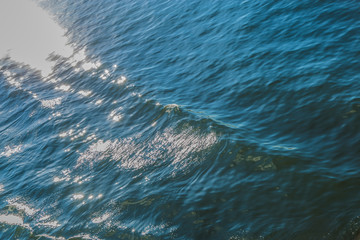 sea wave close up. The glare of the sun on the sea surface