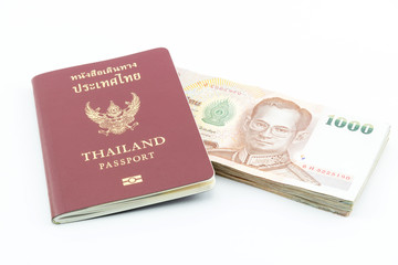 Thailand passport and Thai money isolated on white background