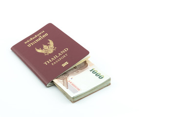 Thailand passport and Thai money isolated on white background