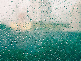 Selective focus and color filter image, Raindrops on glass (raindrops,blur, rain)