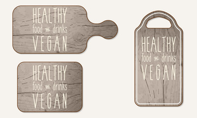 Wooden breadboard with the words healthy, food, drinks; vegan