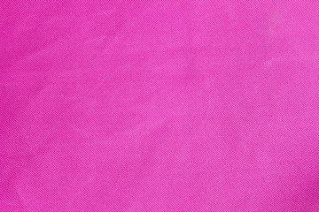 pink crumpled fabric textile surface