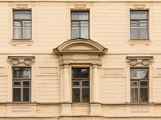 Several windows in a row on facade of the Saint-Petersburg University of Economics front view.