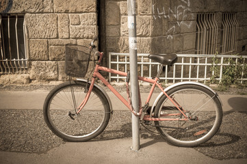 Fototapeta na wymiar Bike in the city. Toned image