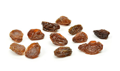 black raisins on a white background (dried fruits)