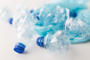 close up of used plastic bottles and rubbish bag