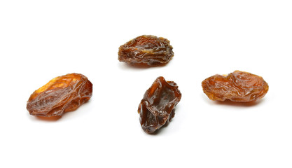 Closeup of black raisins on white (dried fruits)