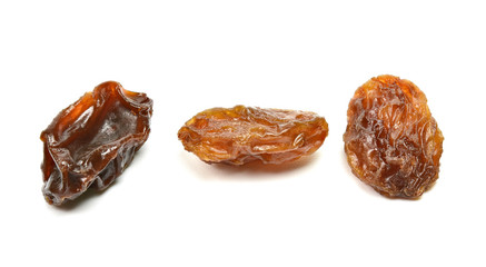 Closeup of black raisins on white (dried fruits)