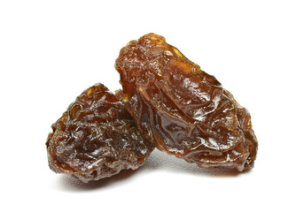 Closeup of black raisins on white (dried fruits)