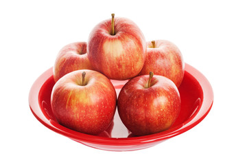 Red apple on plate. Isolated on white background