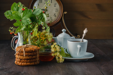 Useful linden tea in cup branches linden flowers and leaves
