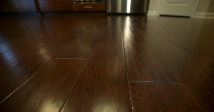 Kitchen Hardwoods Close Up Move Right. camera moves slowly right on the dark brown hardwoods in the kitchen
