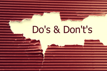 Do's and Don't's Message written under torn paper.