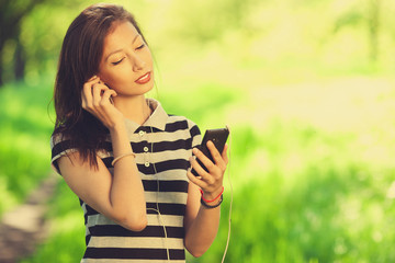 Keep in touch concept. Portrait of beautiful girl using smartphone