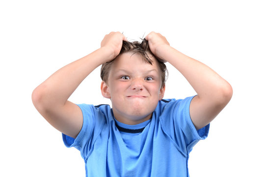 Young Boy Making A Silly Face And Grabbing Hair