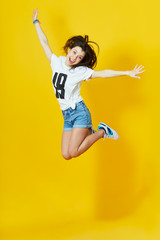 Girl showing her tongue and peace gesture