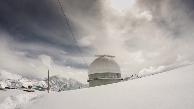 time lapse of the breathtaking view of winter Caucasus mountains with observatory Terskol summit at 3000m in Russia
