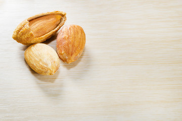 group of almonds isolated on table.