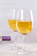 Glasses and bottle of white wine