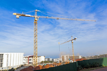 Fototapeta na wymiar Two High Lift Heavy Duty Cranes on Construction Site