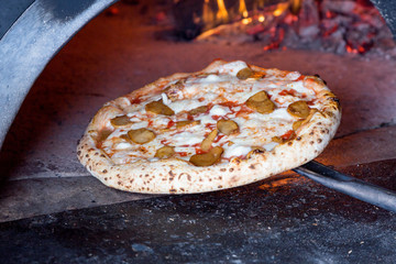 massive oven for pizza on firewood with pizza